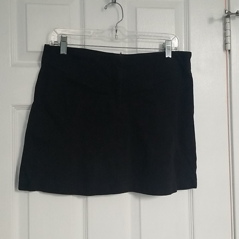 Cotton black miniskirt. Thick fabric soft to touch